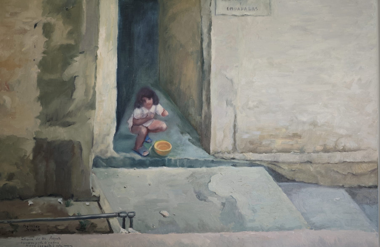 Niña aseándose en época seca.